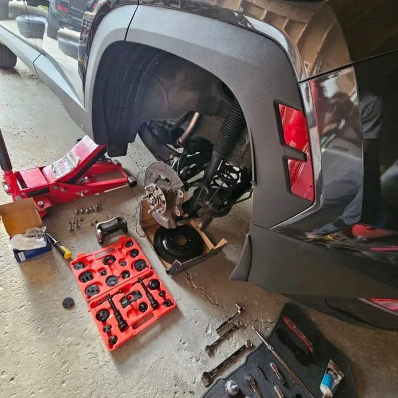 Automotive disassembling brake pads and metallic rotor service